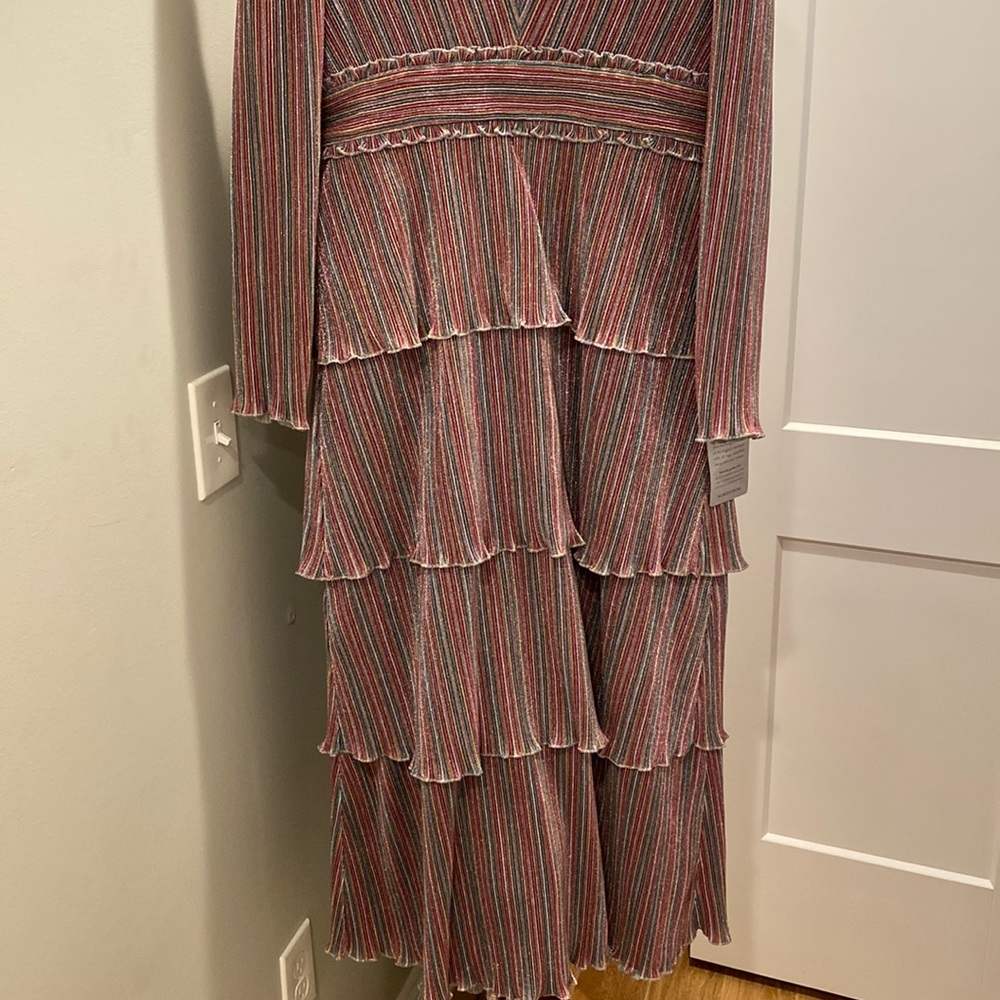 Multi colored tiered ruffle sparkle dress with puff long sleeve.